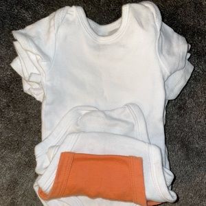 New Born plain white and one orange onesie